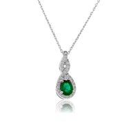 Oval Shaped Emerald Pendant with Diamond Halo - Park City Jewelers