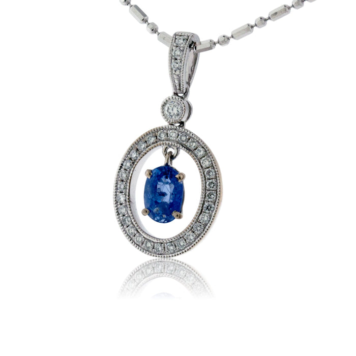 Oval Shaped Sapphire with Diamond Halo Pendant - Park City Jewelers