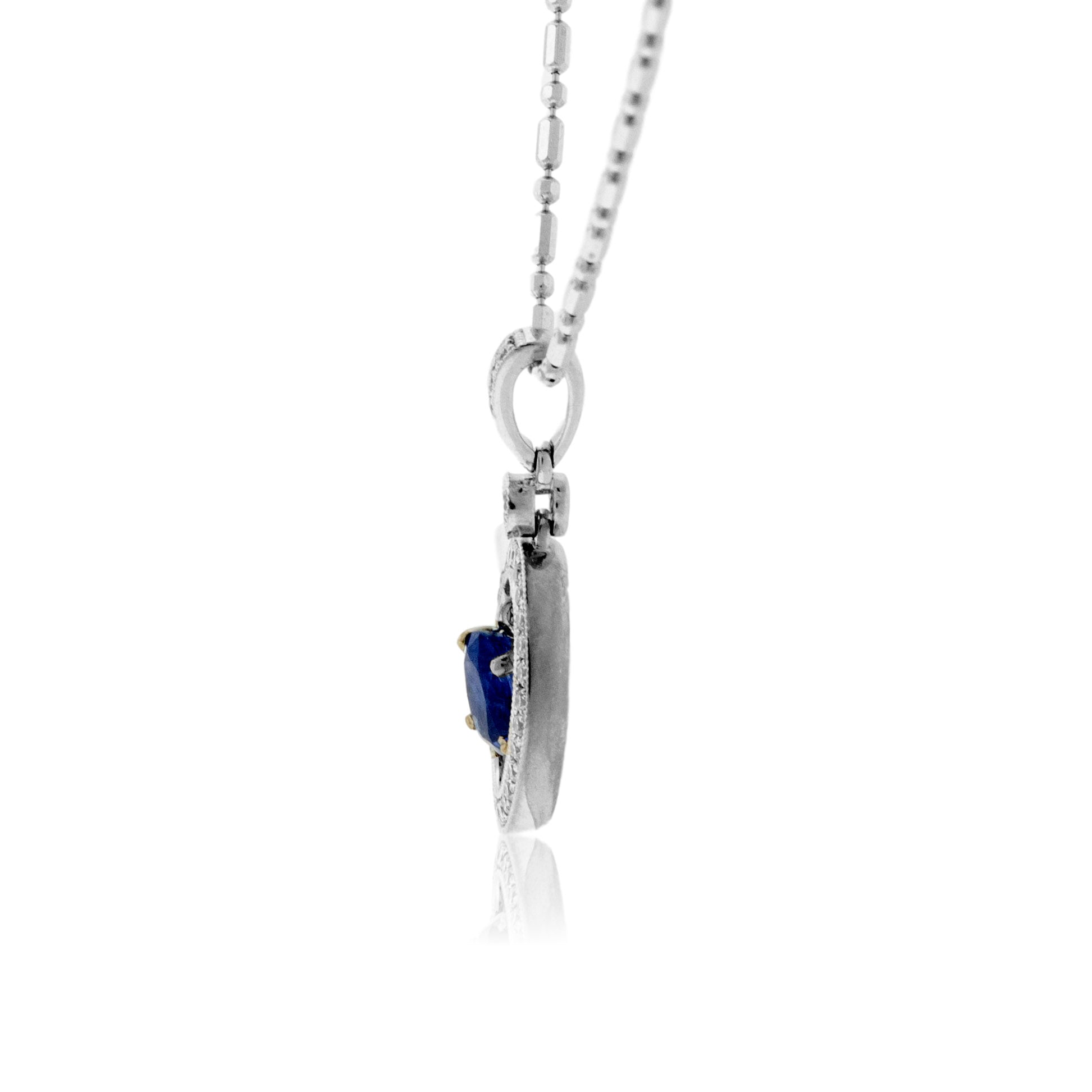 Oval Shaped Sapphire with Diamond Halo Pendant - Park City Jewelers