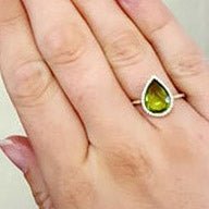 Pear Shaped Peridot with Diamond Halo on Diamond Accented Band - Park City Jewelers