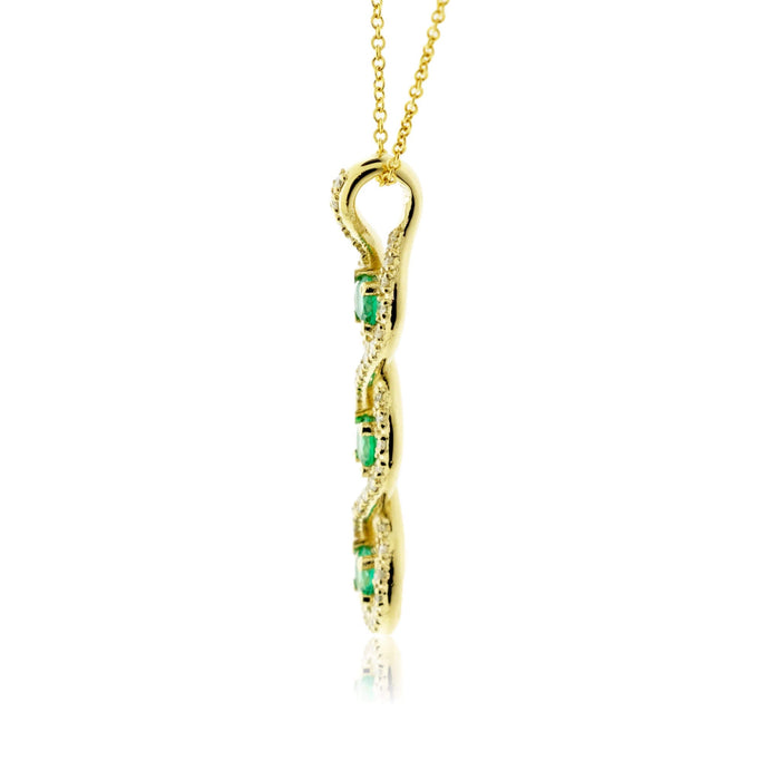 Round-Cut Three Emerald Pendant with Diamond Halo - Park City Jewelers
