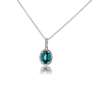 Simple Oval Blue Zircon in Diamond Halo Pendant - Park City Jewelers