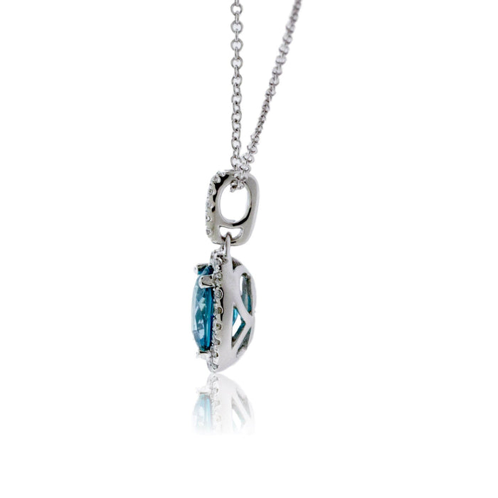 Simple Oval Blue Zircon in Diamond Halo Pendant - Park City Jewelers